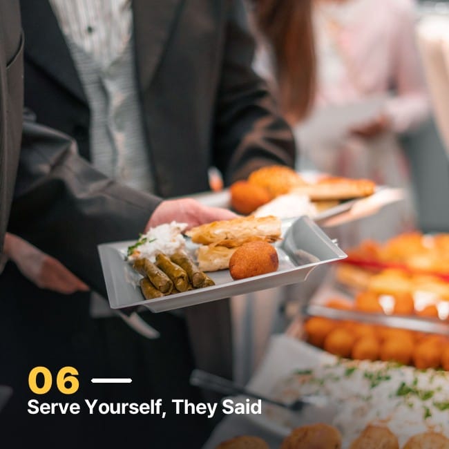 A person serving themselves food at a self-serve counter